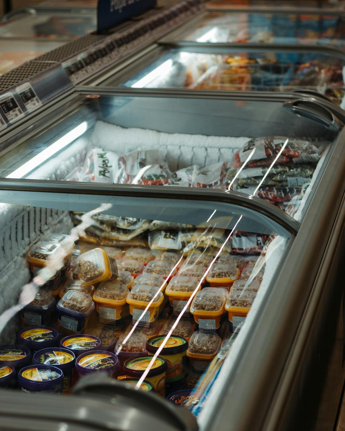 Home freezer packed with frozen food and frost, the scenario the USDA 48-hour rule covers after a power outage